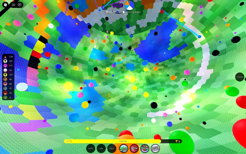 A wide view through Emilie's Hollow World showing colorful paint spheres floating across the green tiled interior during a live team match.