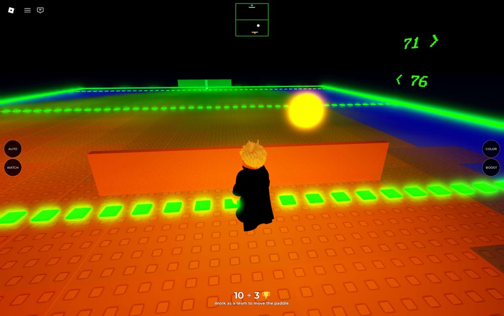 A player standing behind the orange shared paddle as the glowing ball crosses Emilie's Ting Tong arena.