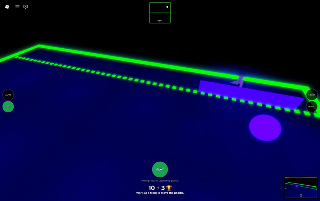 A wide view of the purple shared paddle and glowing ball inside Emilie's Ting Tong arena.